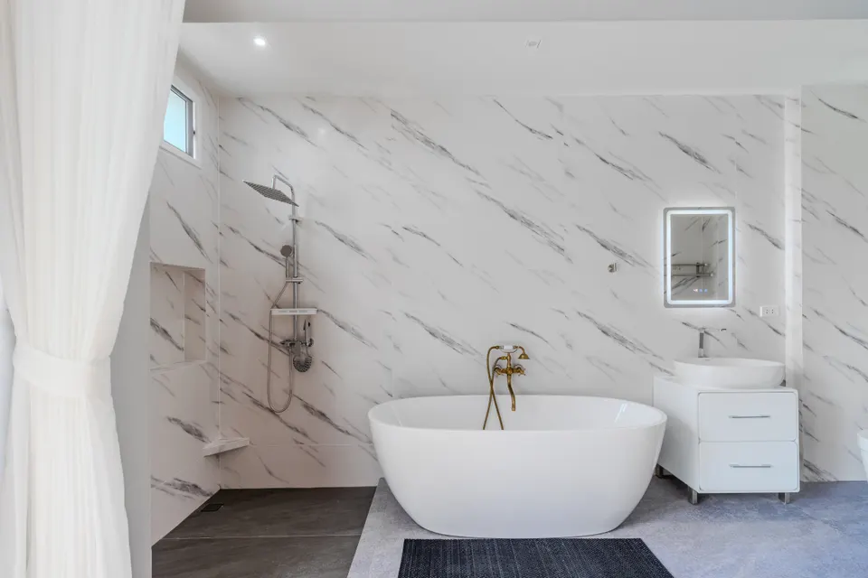 Serenity Pool House, a bathroom with a freestanding bath